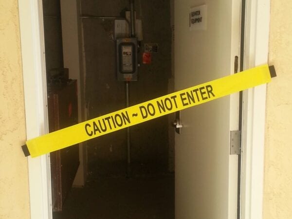 A “Caution, Do Not Enter” Banner on an Electrical Room’s Doorway